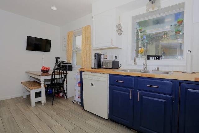 600 Center Dr, Tecumseh, MI 49286 - kitchen featuring dishwasher, blue cabinetry, white cabinets, light wood finished floors, and recessed lighting