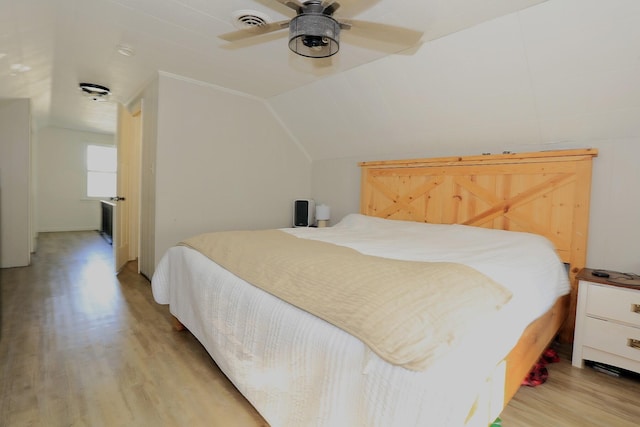 600 Center Dr, Tecumseh, MI 49286 - bedroom with light wood-style flooring, lofted ceiling, and a ceiling fan
