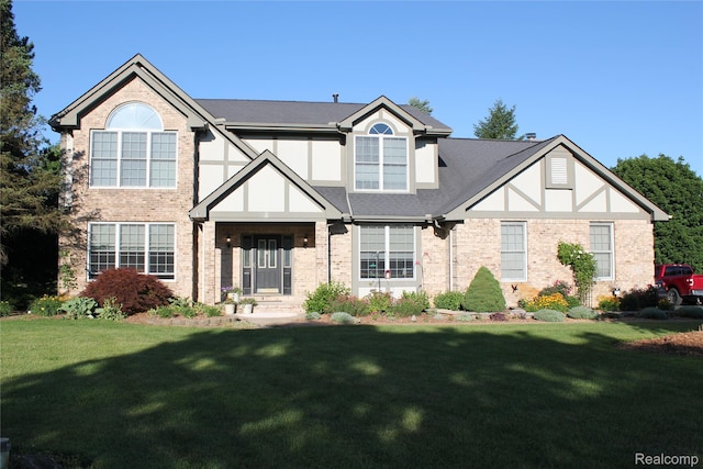300 Crestway Ct, Saline, MI 48176 - tudor home with brick siding and a front lawn