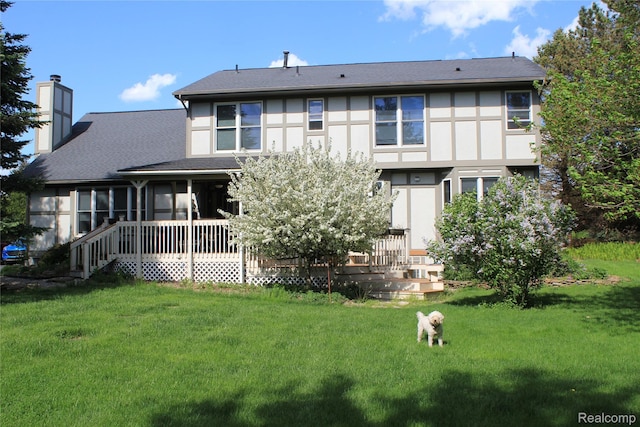 300 Crestway Ct, Saline, MI 48176 - rear view of house with a chimney, a yard, a sunroom, and stucco siding