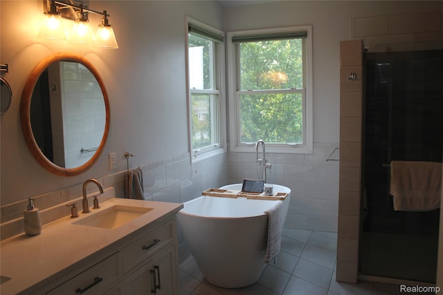 300 Crestway Ct, Saline, MI 48176 - full bathroom with tile walls, tile patterned floors, double vanity, a freestanding bath, and a walk in shower