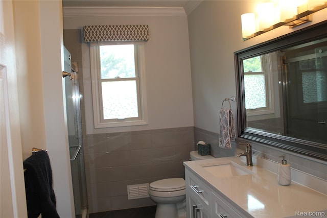 300 Crestway Ct, Saline, MI 48176 - full bath featuring tile walls, vanity, a shower with shower door, ornamental molding, and a wainscoted wall