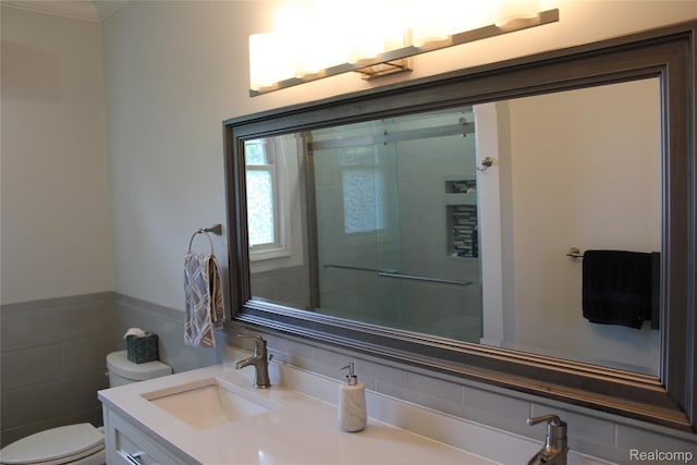 300 Crestway Ct, Saline, MI 48176 - full bath featuring vanity, a shower with door, crown molding, tile walls, and a wainscoted wall