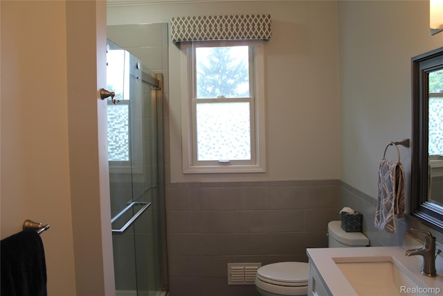300 Crestway Ct, Saline, MI 48176 - bathroom with vanity, tile walls, tiled shower, and a wainscoted wall