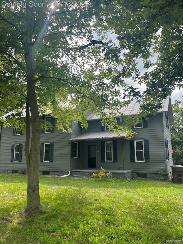 6700 N Stony Creek Rd, Monroe, MI 48162 - view of front of home with a porch and a front yard