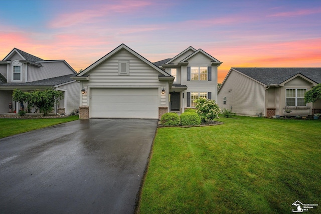 773 Hunting Creek Rd, Temperance, MI 48182 - traditional-style house featuring driveway, a front lawn, an attached garage, and brick siding