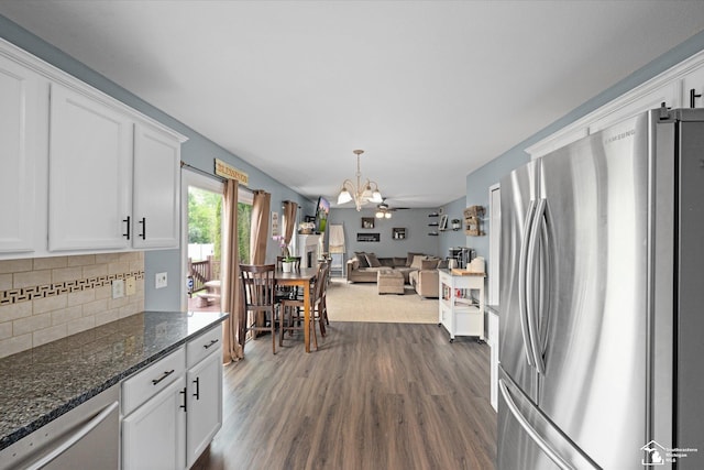 773 Hunting Creek Rd, Temperance, MI 48182 - kitchen featuring stainless steel appliances, a chandelier, white cabinetry, and dark wood-type flooring