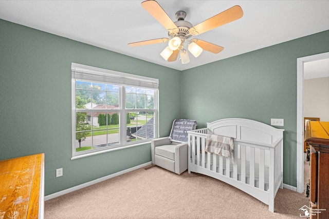 773 Hunting Creek Rd, Temperance, MI 48182 - bedroom featuring carpet floors, baseboards, a crib, and ceiling fan