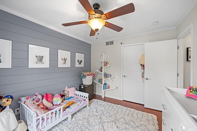 773 Hunting Creek Rd, Temperance, MI 48182 - bedroom with ornamental molding, wood finished floors, a ceiling fan, and wooden walls