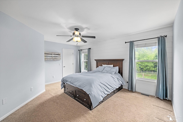 773 Hunting Creek Rd, Temperance, MI 48182 - bedroom featuring carpet flooring, baseboards, a ceiling fan, and an AC wall unit