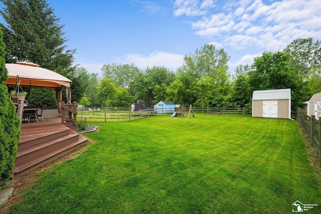 773 Hunting Creek Rd, Temperance, MI 48182 - view of yard with a gazebo, a trampoline, a wooden deck, and a playground