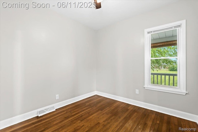 4469 5th St, Ecorse, MI 48229 - spare room featuring baseboards and dark wood finished floors