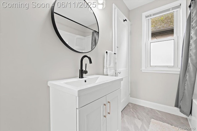 4469 5th St, Ecorse, MI 48229 - bathroom featuring vanity, marble finish floors, baseboards, and shower / bath combo with shower curtain