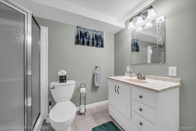 140 Pine Tree Ridge Dr Unit 2, Waterford, MI 48327 - bathroom with toilet, a shower stall, vanity, tile patterned floors, and baseboards