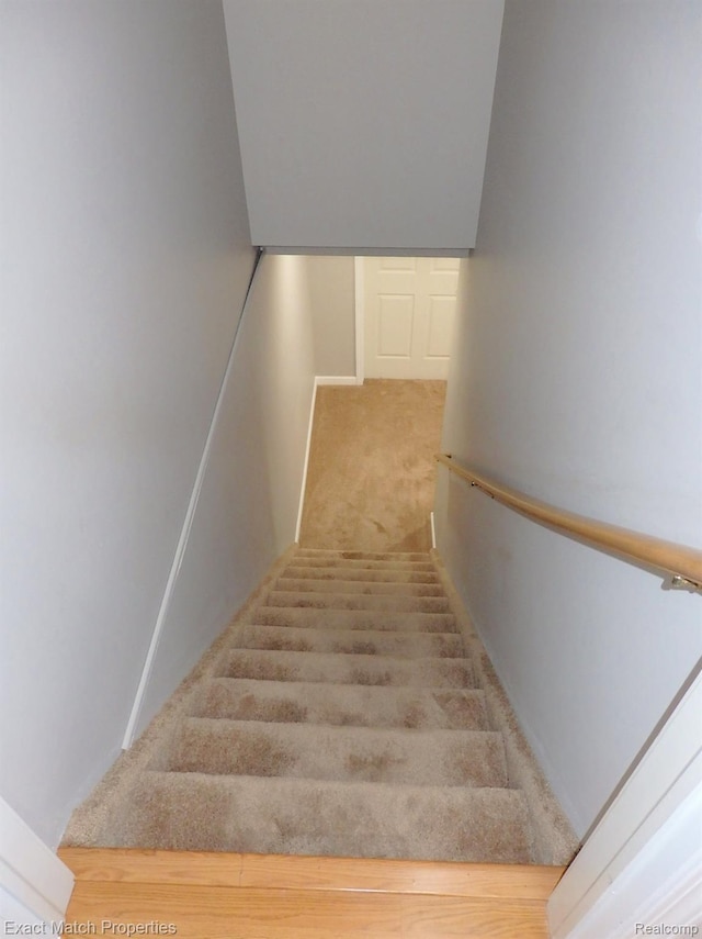 140 Pine Tree Ridge Dr Unit 2, Waterford, MI 48327 - stairs featuring carpet