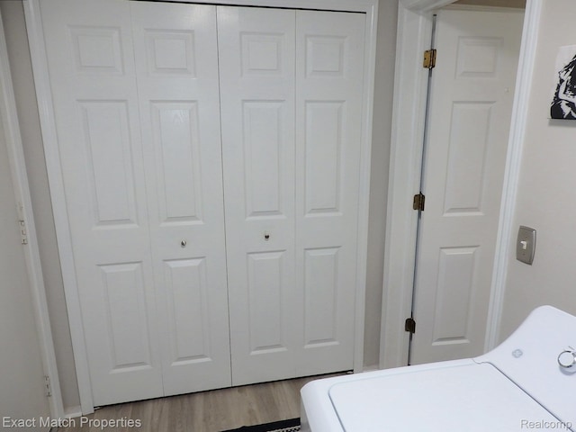 140 Pine Tree Ridge Dr Unit 2, Waterford, MI 48327 - washroom with washer / clothes dryer and wood finished floors
