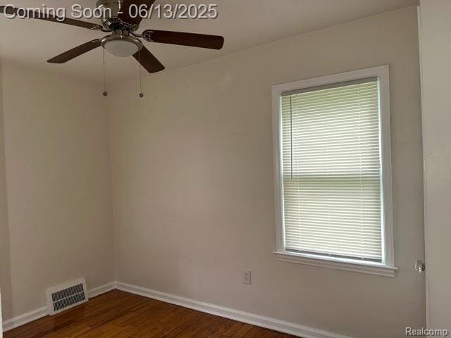 19628 Elkhart St, Harper Woods, MI 48225 - spare room featuring dark wood-type flooring, a ceiling fan, baseboards, and plenty of natural light