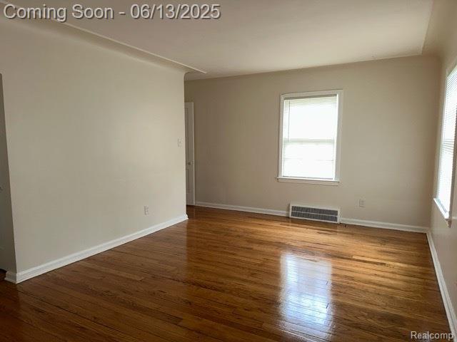 19628 Elkhart St, Harper Woods, MI 48225 - spare room featuring wood finished floors and baseboards