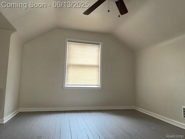 19628 Elkhart St, Harper Woods, MI 48225 - bonus room featuring a ceiling fan, hardwood / wood-style floors, baseboards, and lofted ceiling