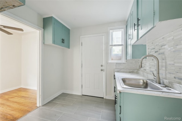 19628 Elkhart St, Harper Woods, MI 48225 - laundry room with ceiling fan and light tile patterned floors