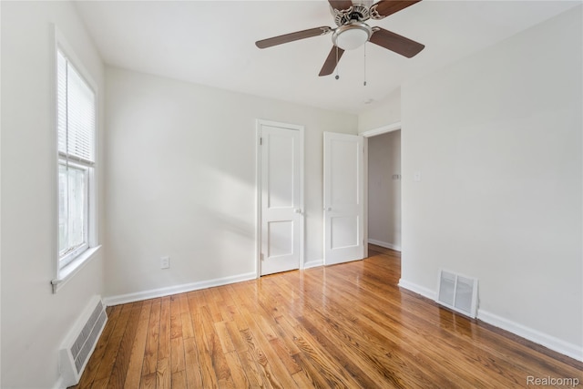 19628 Elkhart St, Harper Woods, MI 48225 - unfurnished bedroom with wood finished floors and a ceiling fan
