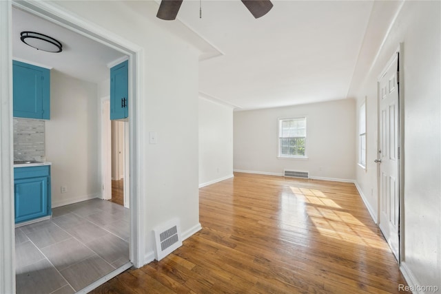 19628 Elkhart St, Harper Woods, MI 48225 - empty room featuring ceiling fan and light wood finished floors