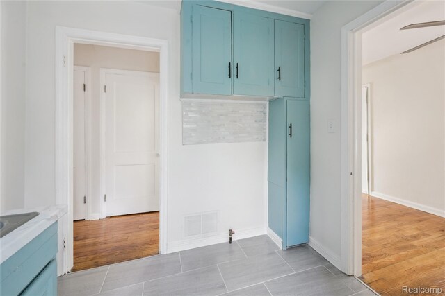 19628 Elkhart St, Harper Woods, MI 48225 - laundry room featuring baseboards and ceiling fan