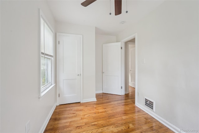 19628 Elkhart St, Harper Woods, MI 48225 - unfurnished bedroom featuring light wood-style floors and ceiling fan
