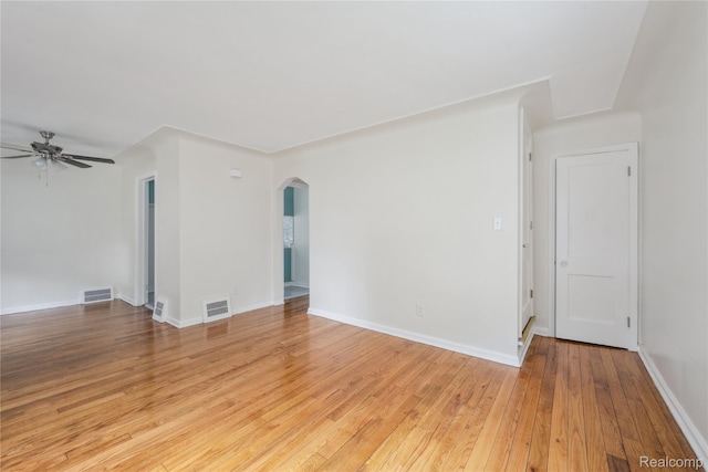 19628 Elkhart St, Harper Woods, MI 48225 - unfurnished room with arched walkways, ceiling fan, and light wood-type flooring