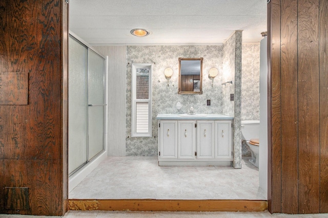 180 Bonnie St, Ludington, MI 49431 - full bathroom with vanity, a stall shower, and toilet