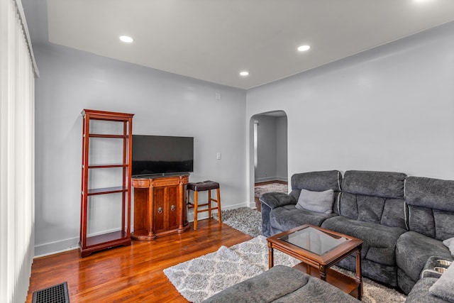 9213 Conant, Hamtramck, MI 48212 - living area with arched walkways, wood finished floors, baseboards, and recessed lighting