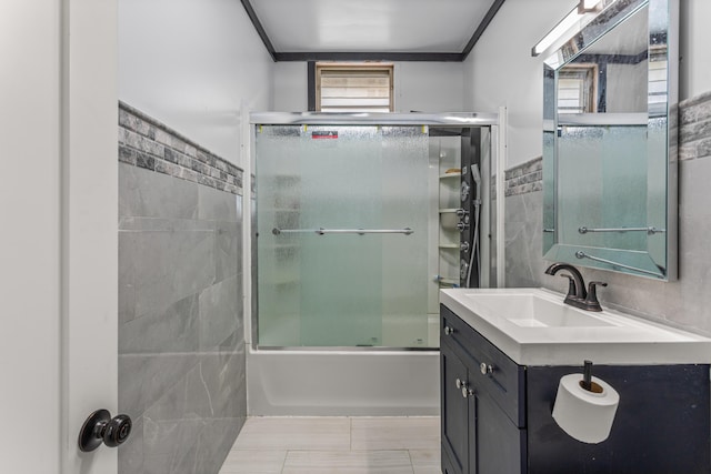 9213 Conant, Hamtramck, MI 48212 - bathroom featuring shower / bath combination with glass door, vanity, and tile walls