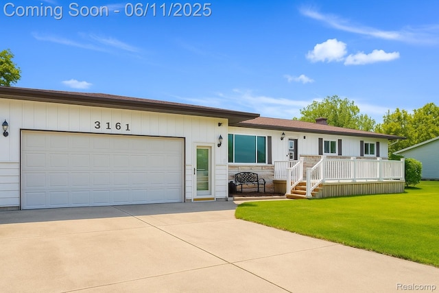 3161 Eastgate St, Burton, MI 48519 - ranch-style home with concrete driveway, a garage, a front lawn, and stone siding