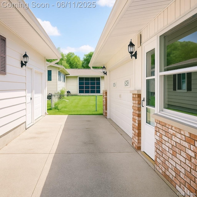 3161 Eastgate St, Burton, MI 48519 - view of patio / terrace featuring a garage and driveway