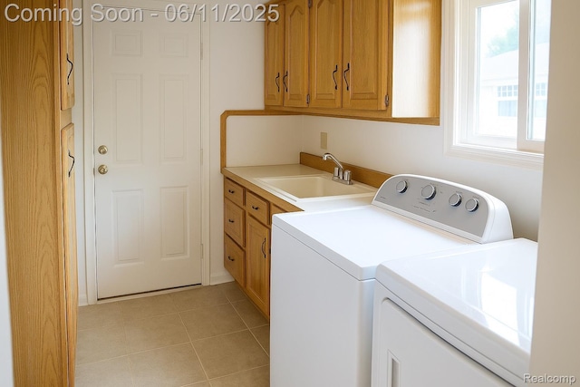 3161 Eastgate St, Burton, MI 48519 - washroom featuring washer and clothes dryer, cabinet space, and light tile patterned floors