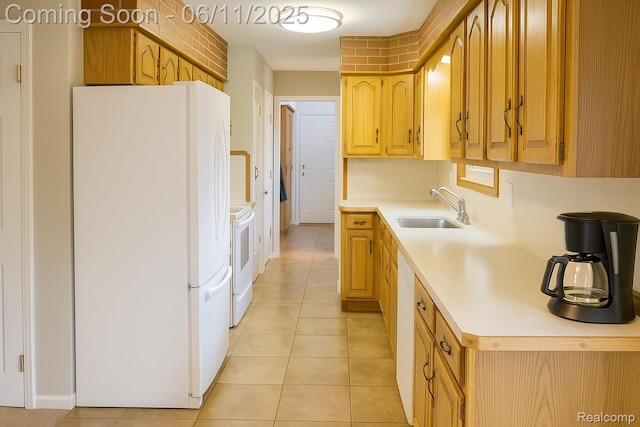 3161 Eastgate St, Burton, MI 48519 - kitchen with white appliances, a sink, light countertops, washing machine and dryer, and light tile patterned floors
