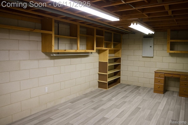 3161 Eastgate St, Burton, MI 48519 - basement with electric panel, light wood-type flooring, and concrete block wall