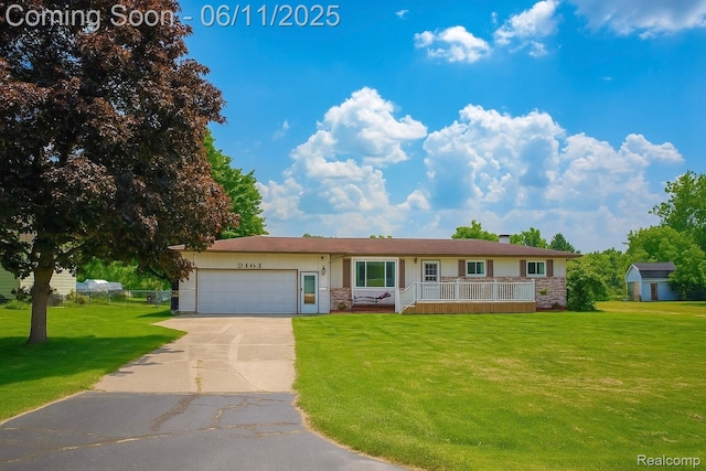 3161 Eastgate St, Burton, MI 48519 - single story home with a front yard, driveway, an attached garage, stone siding, and stucco siding