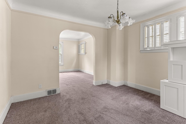 11414 Manor, Detroit, MI 48204 - carpeted empty room featuring arched walkways, a chandelier, baseboards, and crown molding