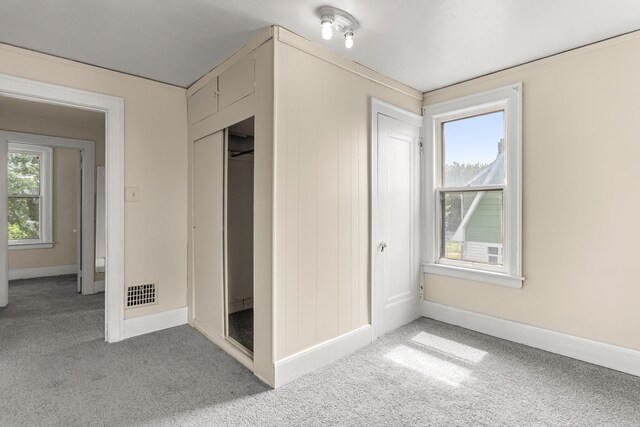 11414 Manor, Detroit, MI 48204 - unfurnished bedroom featuring light carpet, a closet, and baseboards