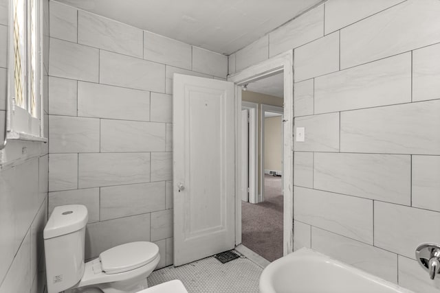 11414 Manor, Detroit, MI 48204 - full bathroom with a bath, toilet, tile walls, and tile patterned flooring