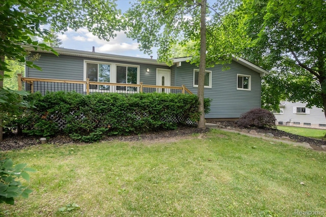 2844 Rose Center Rd, Highland, MI 48356 - rear view of property with a yard and a wooden deck