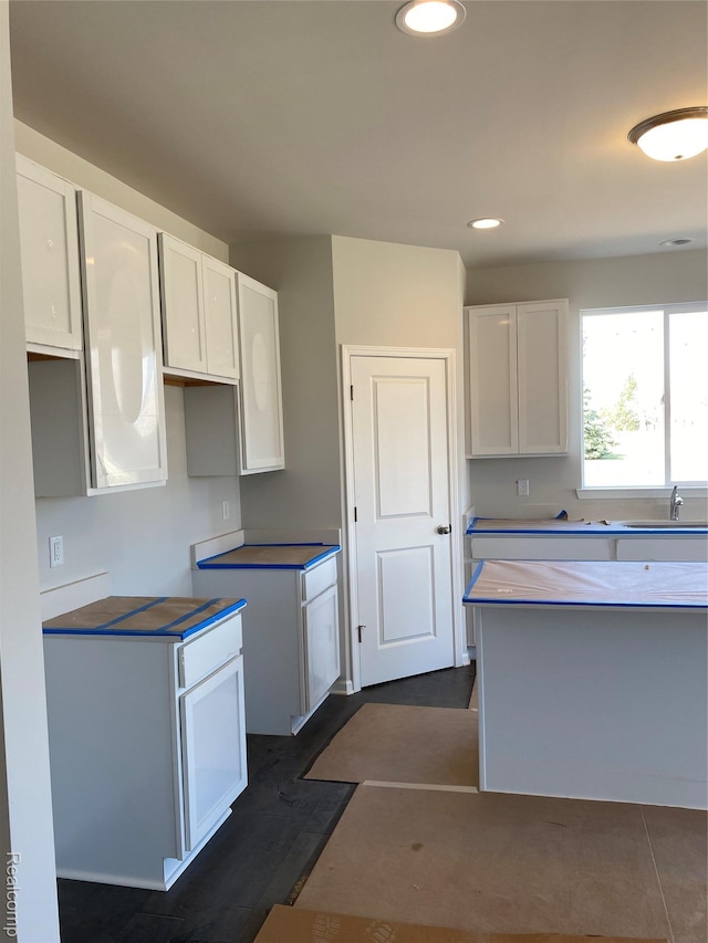33548 Baldwin St, Farmington Hills, MI 48336 - kitchen with white cabinetry, recessed lighting, and dark wood-style floors