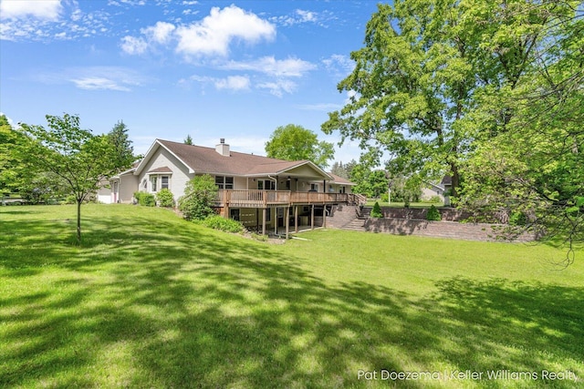 376 Stauffer Dr, Hastings, MI 49058 - view of green lawn featuring a deck and stairs