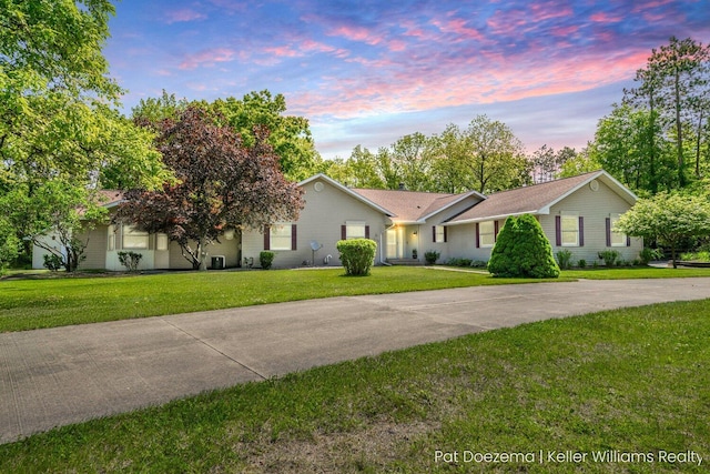376 Stauffer Dr, Hastings, MI 49058 - ranch-style home with a front yard and driveway