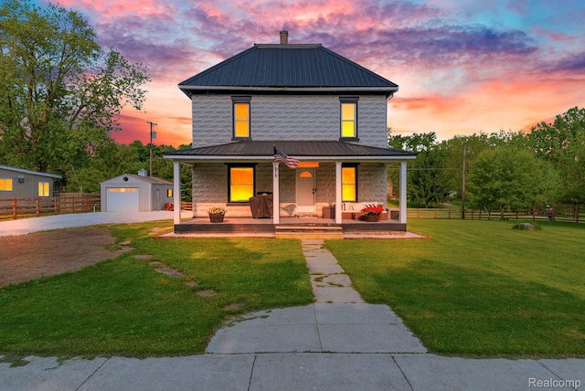 5668 Mill St, Peck, MI 48466 - traditional style home with covered porch, driveway, metal roof, an outbuilding, and a detached garage