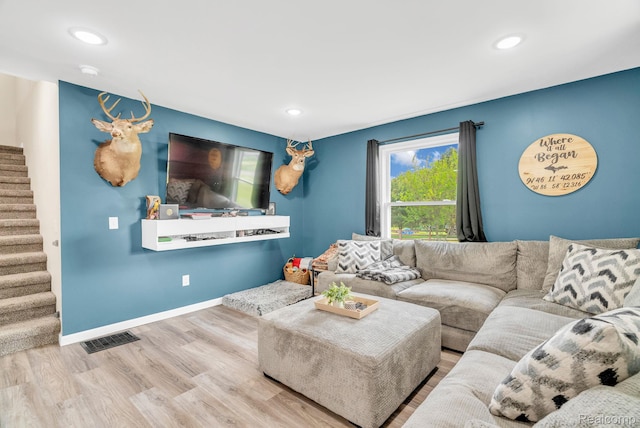 5668 Mill St, Peck, MI 48466 - living room with stairway, plenty of natural light, wood finished floors, recessed lighting, and baseboards
