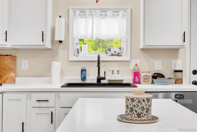 5668 Mill St, Peck, MI 48466 - kitchen featuring a sink, white cabinetry, and light countertops