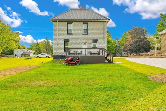 5668 Mill St, Peck, MI 48466 - rear view of property with stairs and metal roof