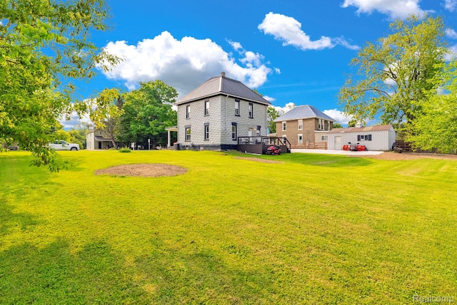 5668 Mill St, Peck, MI 48466 - view of green lawn with a patio area
